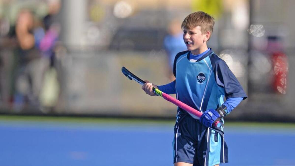 Young hockey players practicing basic skills